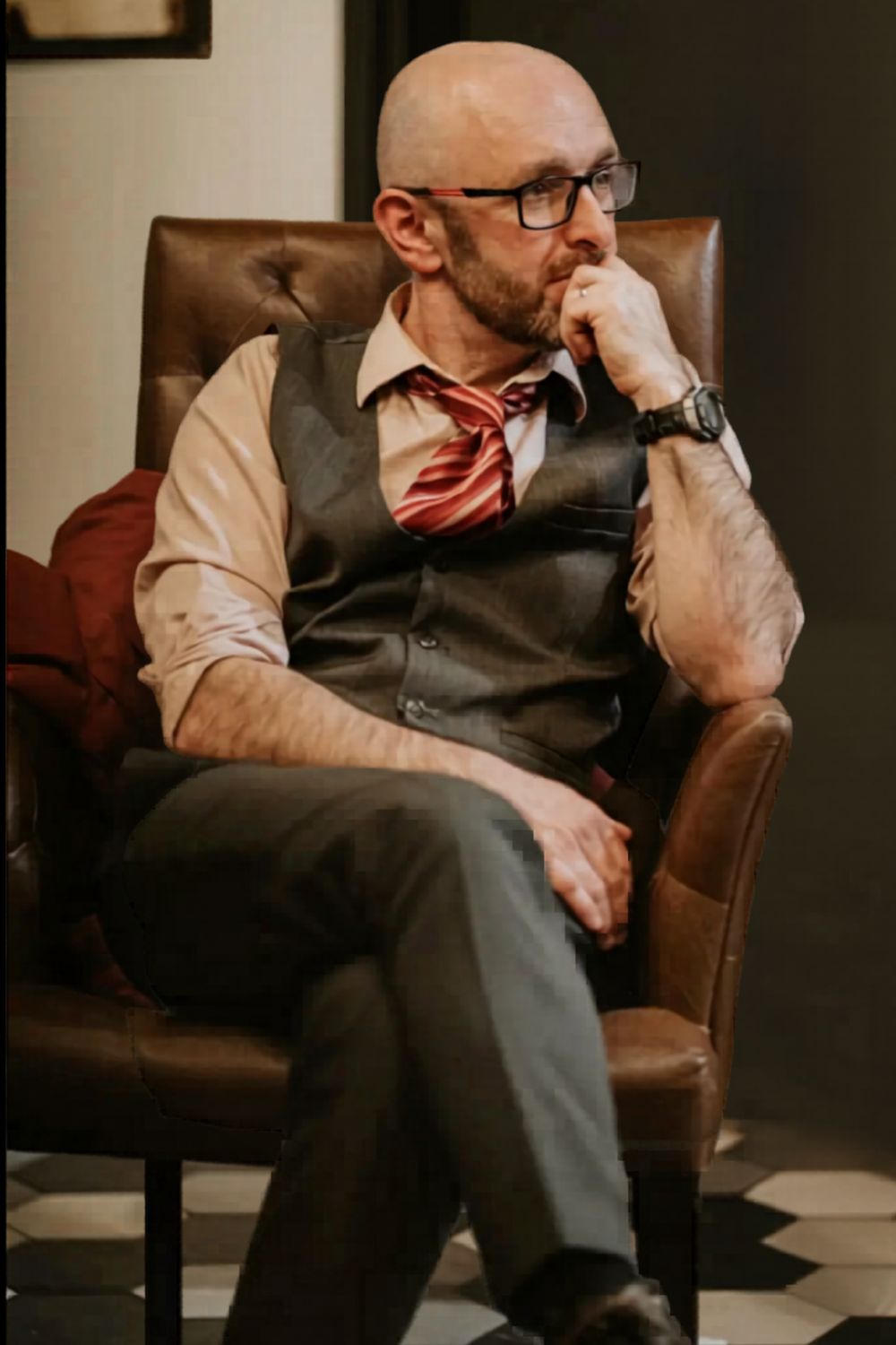 Andy Webster seated with guitar
